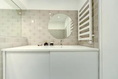 a bathroom with a sink and a mirror at Center Apartment, Vilnius, Old Town in Vilnius