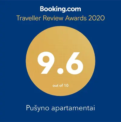 a yellow circle with the number nine and the text travelling review awards at Pušyno apartamentai in Anykščiai