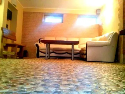 a living room with a couch and a table at Marijonu Apartments in Panevėžys
