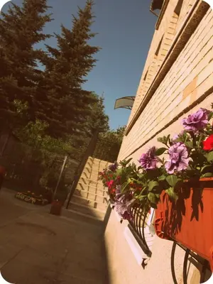 a building with flowers on the side of it at Marijonu Apartments in Panevėžys