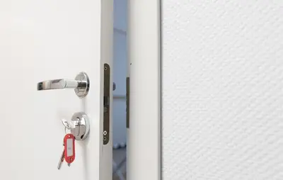 a door with a lock and a key at Hostel Liberty in Kaunas