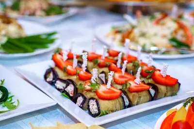 a plate of food with vegetables on top of it at Kornealita in Visaginas