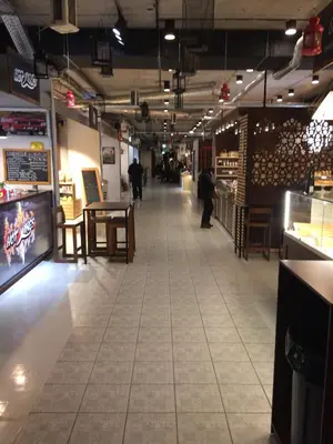 a hallway of a store with a table and chairs at Spacious apartment close to the Old Town in Vilnius