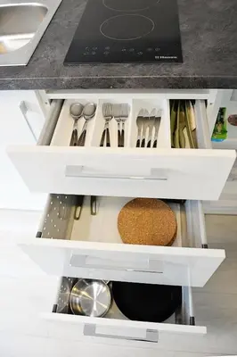 a drawer in a kitchen with utensils at Lofts - Kaunas airport in Karmėlava