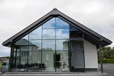a building with a lot of glass at Lofts - Kaunas airport in Karmėlava