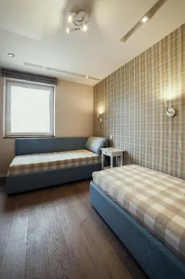 a bedroom with two beds and a window at Geras miegas in Druskininkai