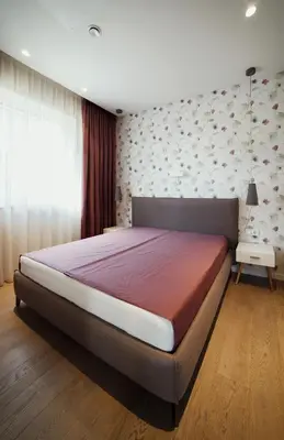 a bedroom with a large bed in a room at Geras miegas in Druskininkai