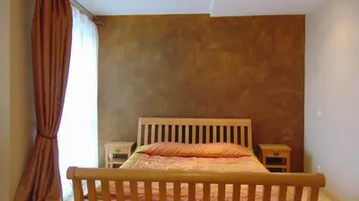 a bedroom with a bed and a window at Villa Alicante & SPA in Zujūnai