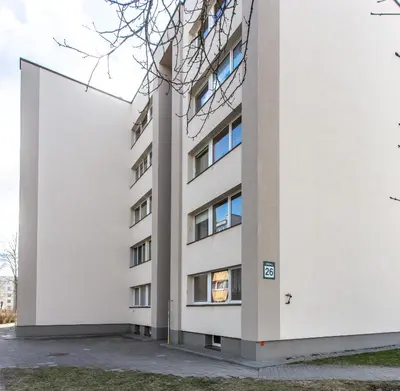 an external view of a white building at Gerda Apartments in Druskininkai