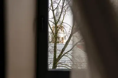 a view of a building through a window at Big Stone in Ukmergė