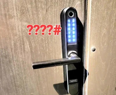 a close up of a door with a cell phone on it at HaPPy Inn GOLD Studio, self check-in, Parking in the underground garage in Vilnius