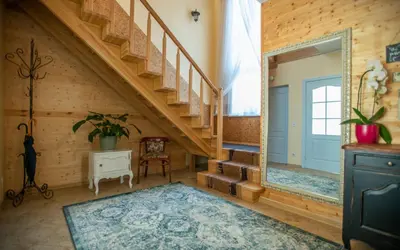 a room with a staircase and a mirror at Green Gile Villa in Druskininkai Center in Druskininkai