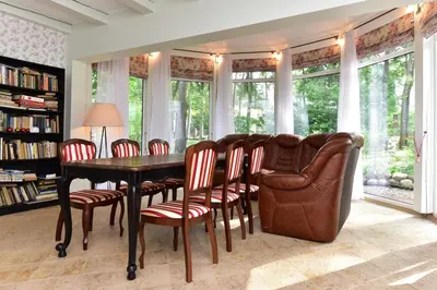 a dining room with a table and chairs at Green Gile Villa in Druskininkai Center in Druskininkai