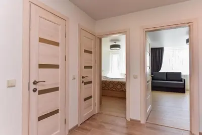 a room with a door leading to a bedroom at Crystal Grey in Druskininkai