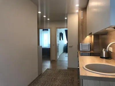 a kitchen with a sink and a microwave at Crystal Grey in Druskininkai