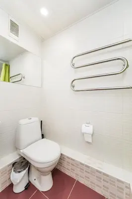 a bathroom with a white toilet in a room at City break. Center in Kaunas