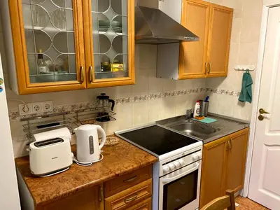 a kitchen with a sink and a counter top at Your Home - Central studio apartment, balcony, parking & Self Check-in in Vilnius