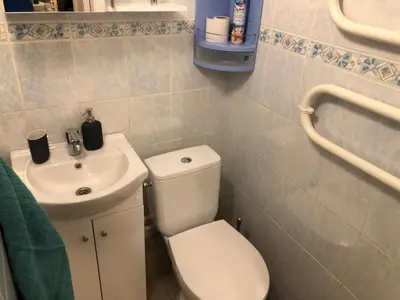 a bathroom with a toilet and a sink at Your Home - Central studio apartment, balcony, parking & Self Check-in in Vilnius