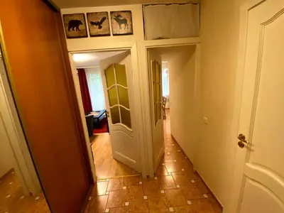 a hallway with a door leading into a room at Your Home - Central studio apartment, balcony, parking & Self Check-in in Vilnius
