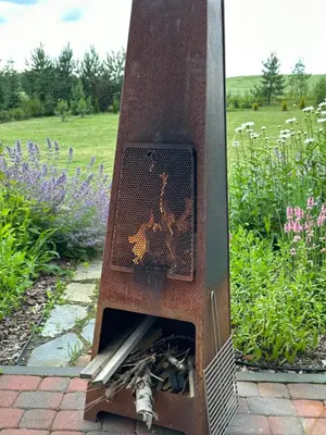 a traffic light in a garden with flowers at Villa Vita in Seimėnai