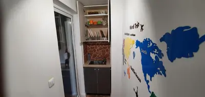a room with a map of the world on the wall at ApartHotel SAVAS 3 Studio and parking in Kaunas