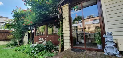 a store front with a cat statue in front of it at ApartHotel SAVAS 3 Studio and parking in Kaunas