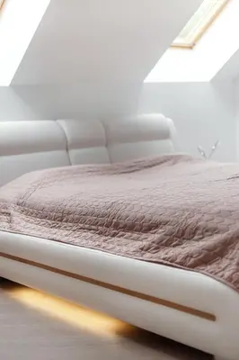 a white bed in a white room with a bedspread at Luxurious Kaunas Basilica Apartment in Old Town by Urban Rent in Kaunas