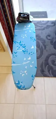 a blue vase with birds on it sitting on the floor at Kaunas Downtown Apartments in Kaunas