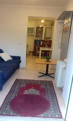 a living room with a couch and a table at Kaunas Downtown Apartments in Kaunas