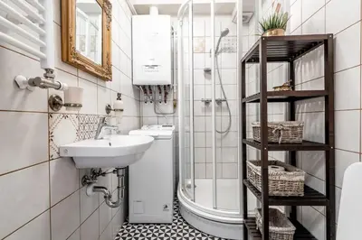 a bathroom with a sink and a shower at Angel House Vilnius, 6 in Vilnius