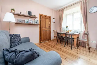a living room with a couch and a table at Angel House Vilnius, 5 in Vilnius