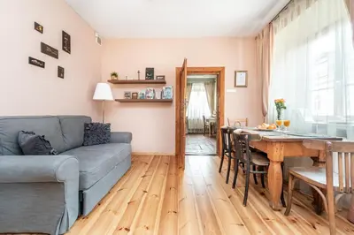 a living room with a couch and a table at Angel House Vilnius, 5 in Vilnius