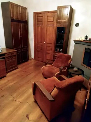 a living room with a couch and two chairs at Saint Stephen Old Town Apartment in Vilnius