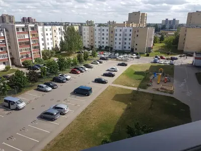 an aerial view of a parking lot with parked cars at Klaipėdos 99 Apartamentai in Panevėžys