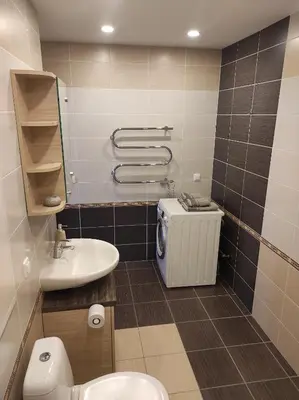 a bathroom with a toilet and a sink at Klaipėdos 99 Apartamentai in Panevėžys