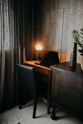 an office with a desk with a laptop and a chair at ERTA Anykščių Namai in Anykščiai