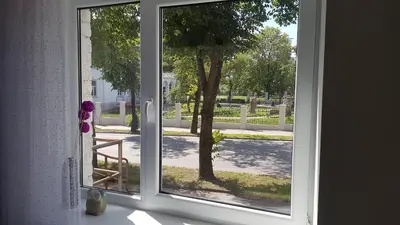 an open window with a view of a yard at TIP TOP in Šiauliai