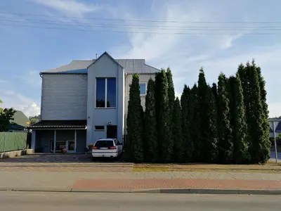 a house with a car parked in front of it at Arvydo Gylio sodyba in Ignalina