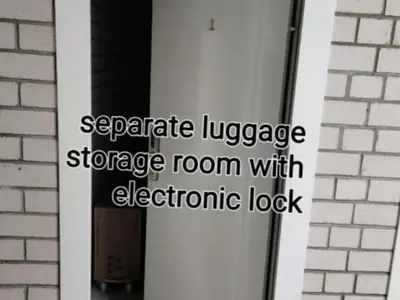 a door with the words separatelez storage room with electronic lock at HaPPy Inn Emporia, Self chek-in, Parking in the underground garage in Vilnius