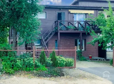 a house with a fence in front of it at Apartamentai Biržuose, double bedroom and single bedroom Apartments in Biržai