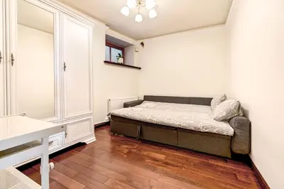 a small bedroom with a bed and a window at Old Town Gate Residence in Vilnius