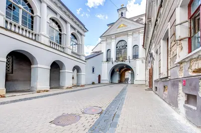 an empty street in front of a building at Old Town Gate Residence in Vilnius