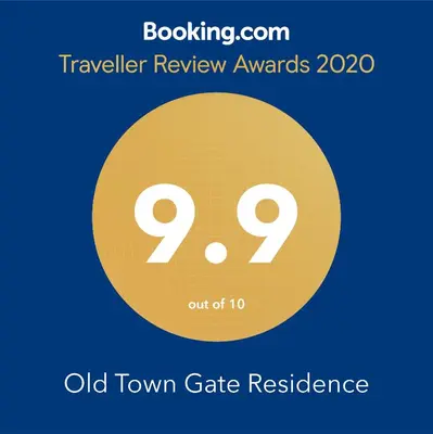 a yellow circle with the words travel review awards on it at Old Town Gate Residence in Vilnius