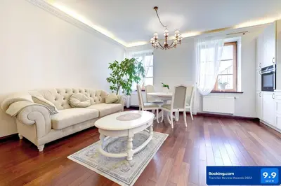 a living room with a couch and a table at Old Town Gate Residence in Vilnius