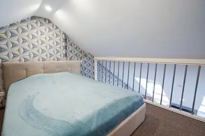 a bedroom with a bed and a balcony at A. Vienuolio gatvė Apartamentai in Vilnius
