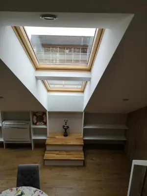 a skylight in the ceiling of a room with stairs at A. Vienuolio gatvė Apartamentai in Vilnius