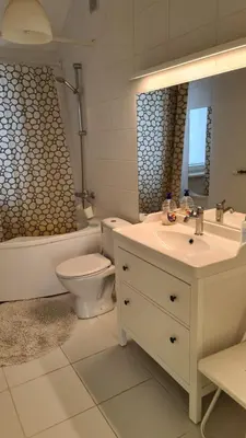 a bathroom with a sink and a toilet and a mirror at Sofia apartments, 6 rooms, 260m2 in Vilnius