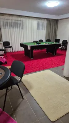 a room with a ping pong table and chairs at Sofia apartments, 6 rooms, 260m2 in Vilnius