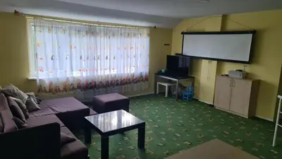 a living room with a couch and a large screen at Sofia apartments, 6 rooms, 260m2 in Vilnius