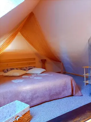 a bedroom with a bed in a tent at White homestead in Sumiliszki